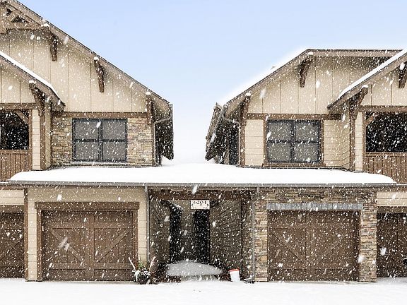 Heated garage and covered walkway for ease of winter living
