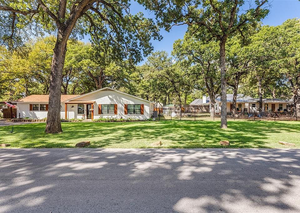 Beautifully renovated main house with two income-producing cottages. Tranquil and peaceful setting on cul-de-sac lot just off Eagle Mountain Lake.