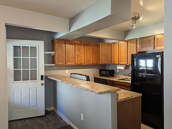 Step-saving kitchen has plenty of cabinet space, a full height pantry and newer appliances, including a dishwasher! Countertop microwave included if desired.
