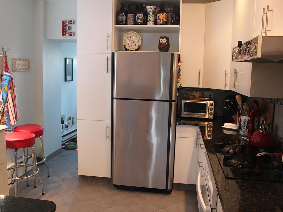 kitchen leading to laundry area and deck
