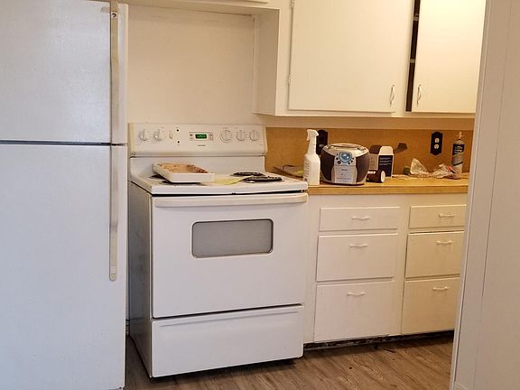 Stove and refrigerator, new kitchen flooring
