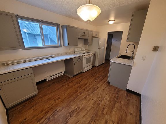 Kitchen with new cabinets, counters and sink/ disposal