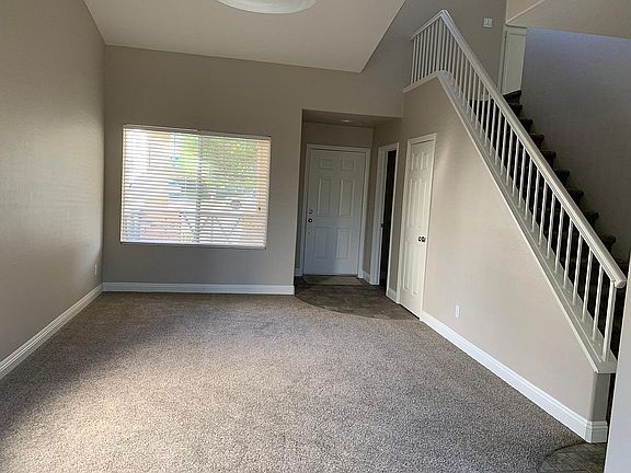 Formal living room with access to spacious storage closest.