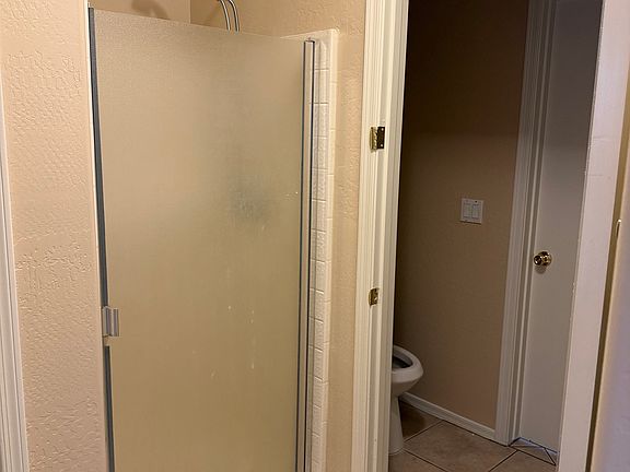 Master bathroom, dual entrance so toilet/sink can be used from living room entrance as well as master bedroom