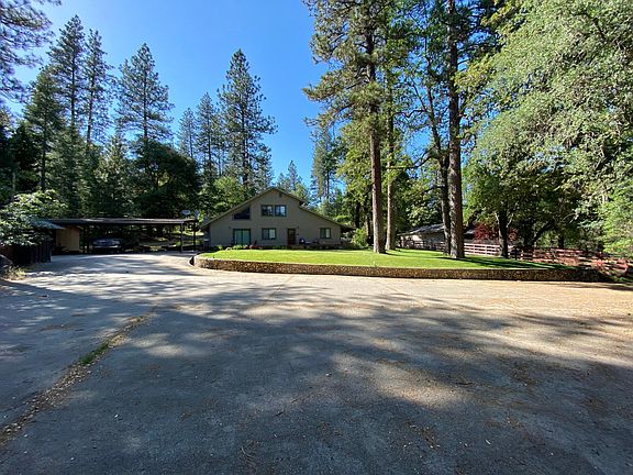 large driveway- 3 car carport- storage