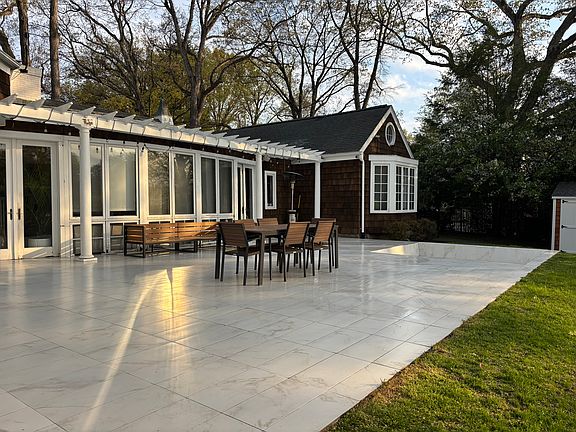 Beautiful porcelain patio with ample space for entertaining!