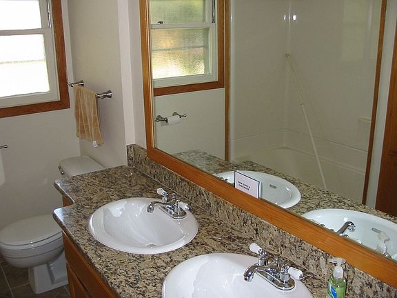 Remodeled bathroom with new granite, new tile floor, new fixtures