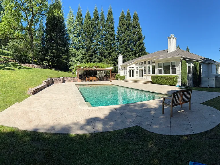 View of outdoor kitchen and pool