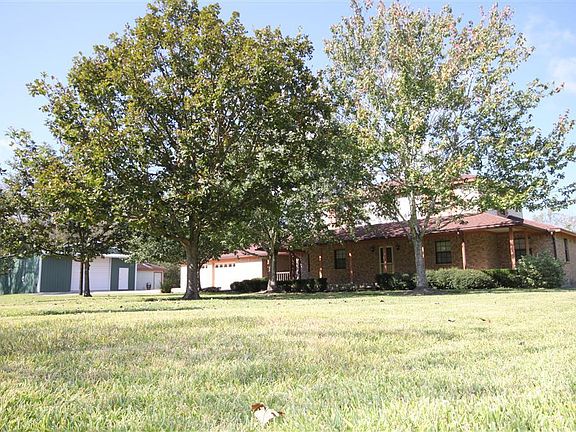 WHAT A DEAL! This gorgeous & well-maintained home & shop is located on an amazing 6.51 acre tract (per BCAD) that is not in the flood zone! Property is in Zone "X". (Roof & OSSF new in 2010.)