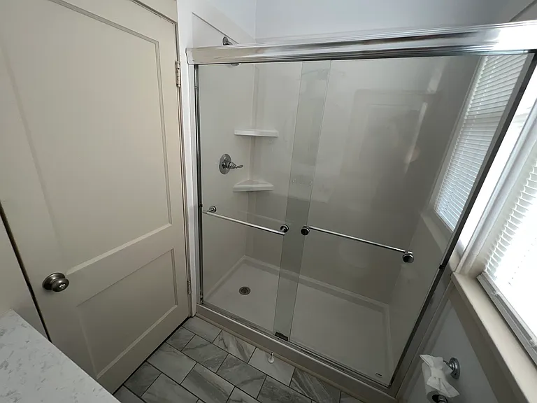 Enclosed shower in bathroom