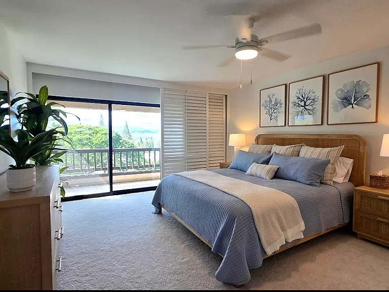 Primary bedroom with small lanai and peek-a-boo ocean view