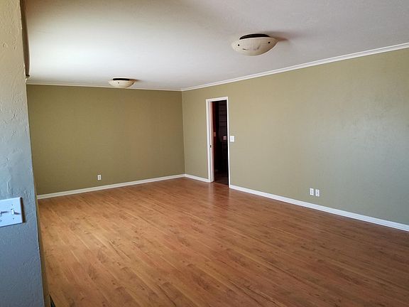 Large living room with built in book cases.