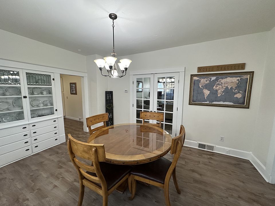 Dinning Room with French Doors leading to the Family Room. The other opening leads to the Kitchen.