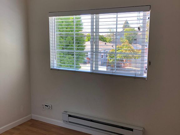 view out bedroom window, electric baseboard heater