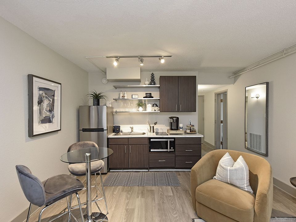 Kitchen & dining area with quartz counters, modern cabinetry, and stainless appliances