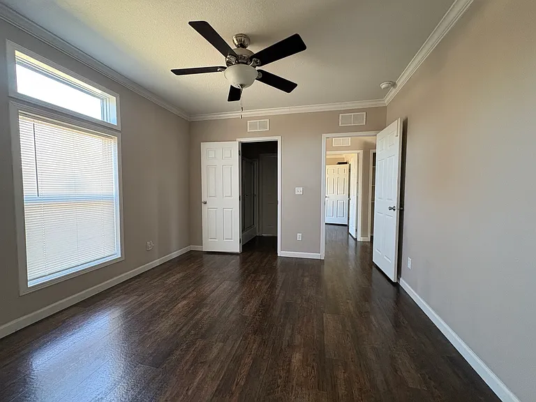 bedroom 3 with jack and jill bathroom on left and door leading out on right