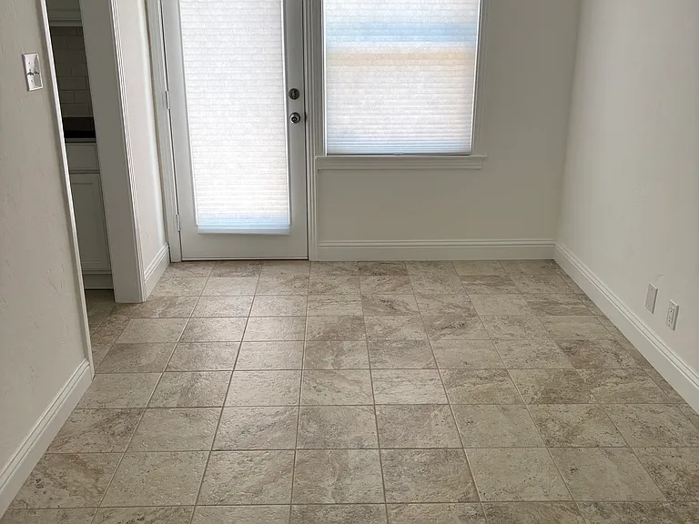Dining area, showing door to backyard, kitchen entry is to the left