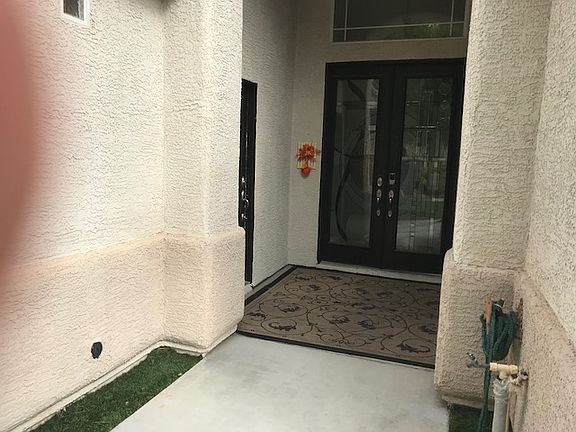 Main entry with custom doors
