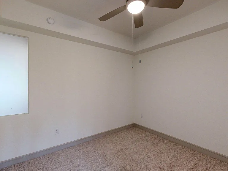 Spacious apartment Bedroom with Carpet Floor.