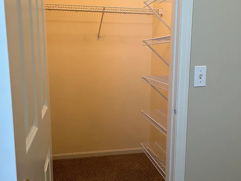 Walk in closet in one of the rooms