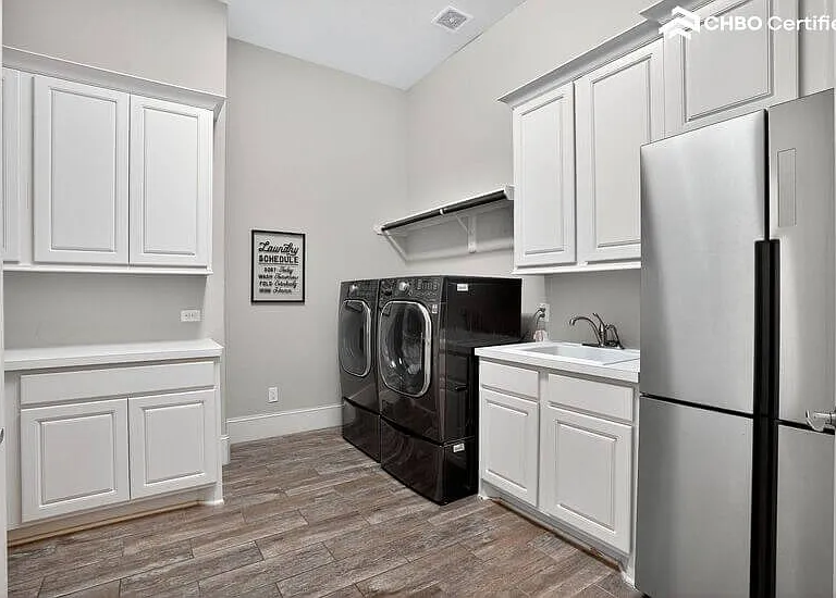 Laundry room with full appliances