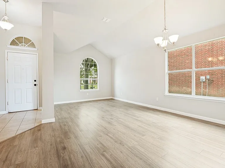 Front entry with large living room combined with the formal dining room