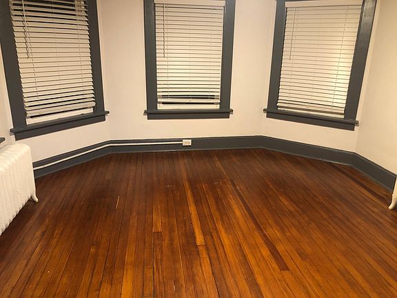 Master bedroom with river view above also-curved living room (not yet pictured). 5 windows (only see 3 of them here)