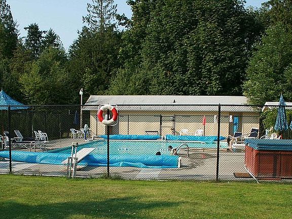Pool with bathrooms and cha.