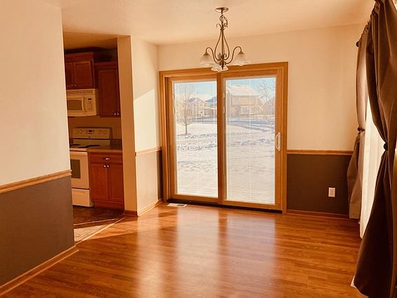 Dining room leads to the open deck and opens to kitchen.