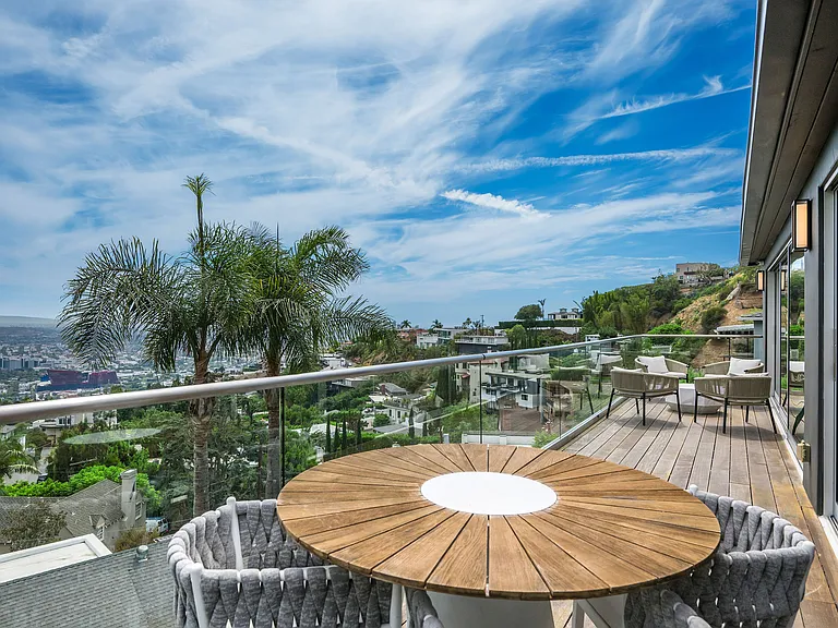 Outdoor table with seating for 4 for light meals and views of the city skyline.