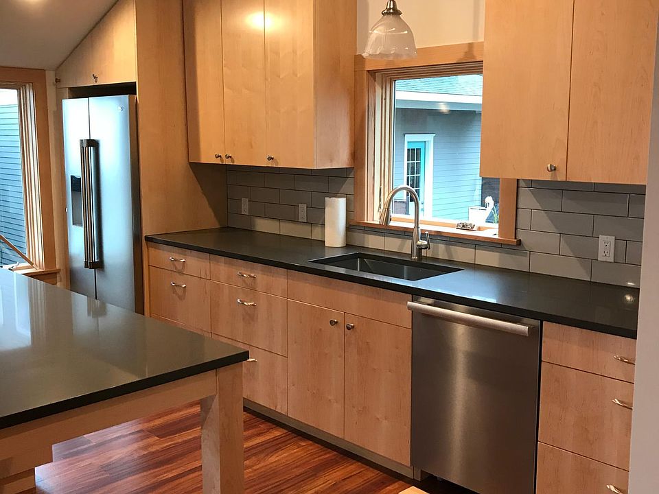 Kitchen with brand new, high-end appliances; tons of counter space and eating bar.