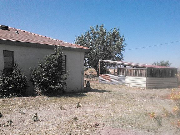 North side of house and hut