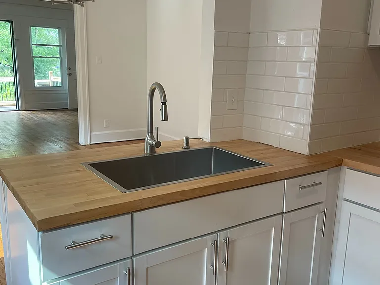 Open concept layout. Brushed nickel finishes. Garbage disposal, soap dispenser, and high quality cabinets.