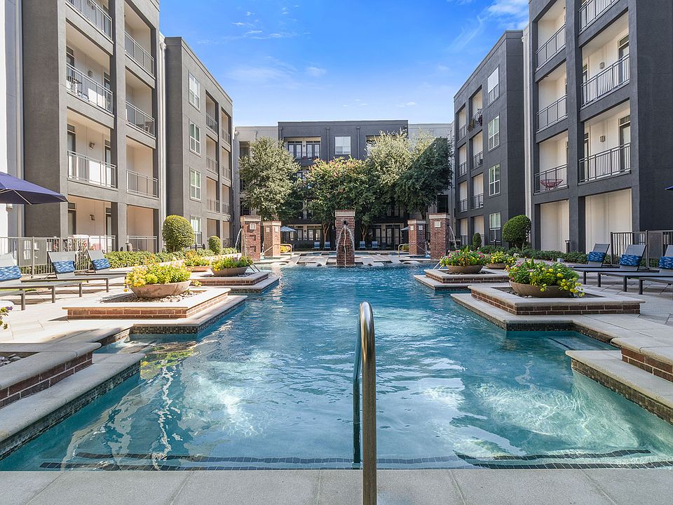 Resort-style swimming pool with tanning areas