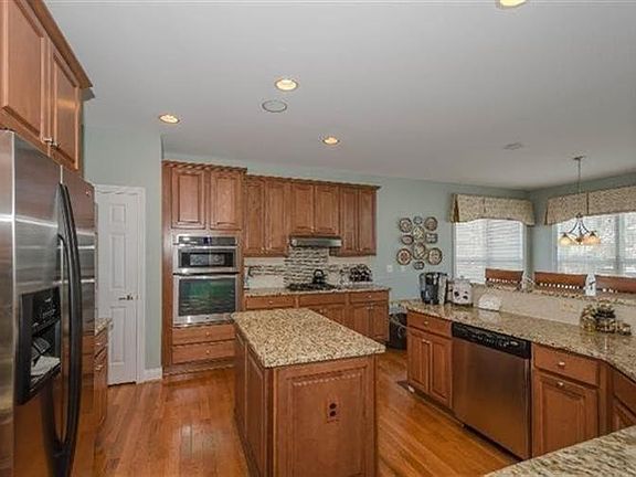 All newer 2012 Stainless Steel appliances granite with glass tile backsplash all cabinet end have panel upgrades on each end of the cabinets for that finished look