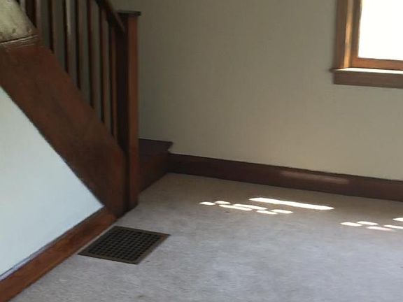 Living room with steps to bedrooms