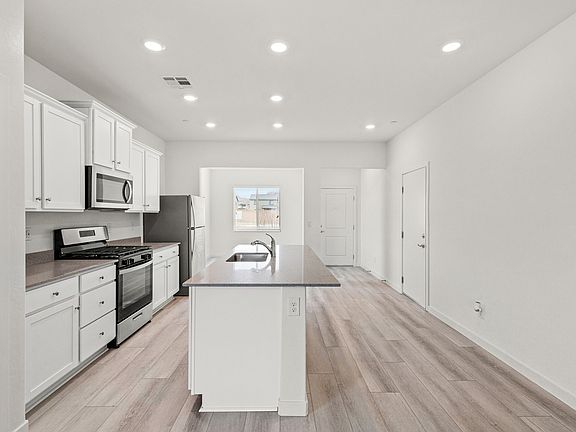 Enjoy the breakfast bar with spacious countertops for a relaxed meal.