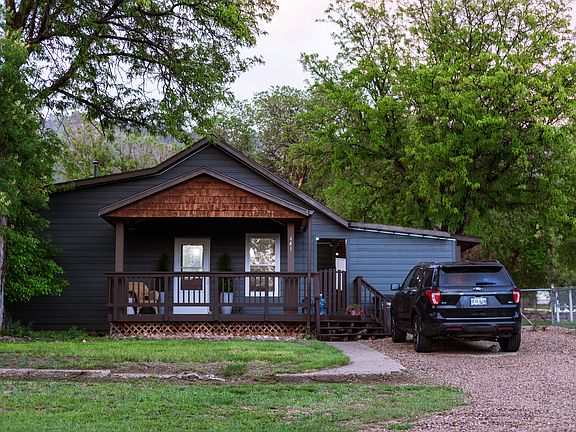 Front driveaway, front deck and fenced in yard