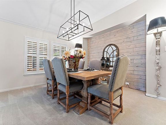 Beautiful formal dining room with wood statement wall.