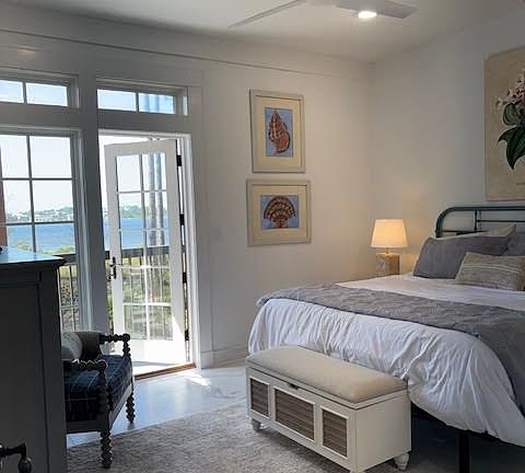 Master bedroom and patio with Phillips Inlet beyound