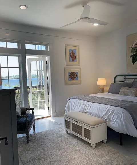 Master bedroom and patio with Phillips Inlet beyound