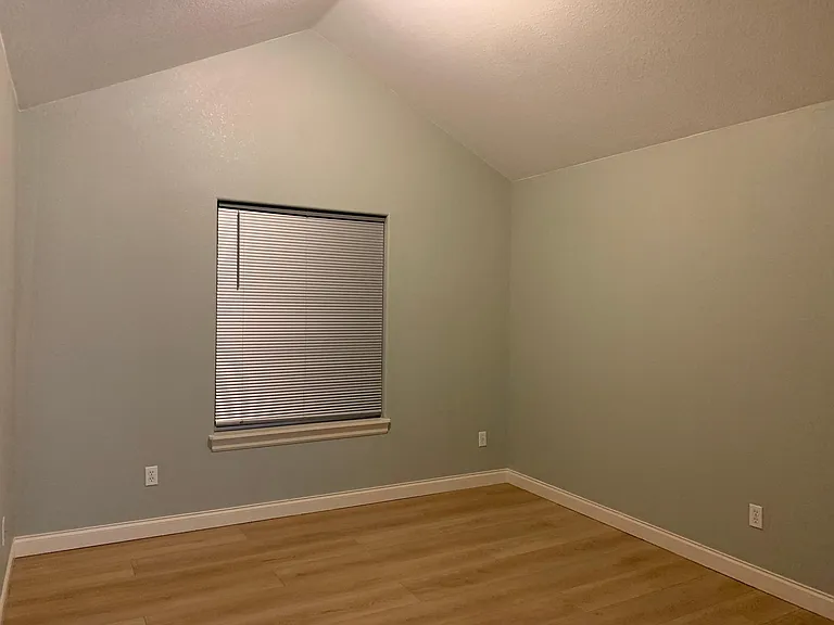 Primary bedroom suite with walk-in closet and full bathroom.