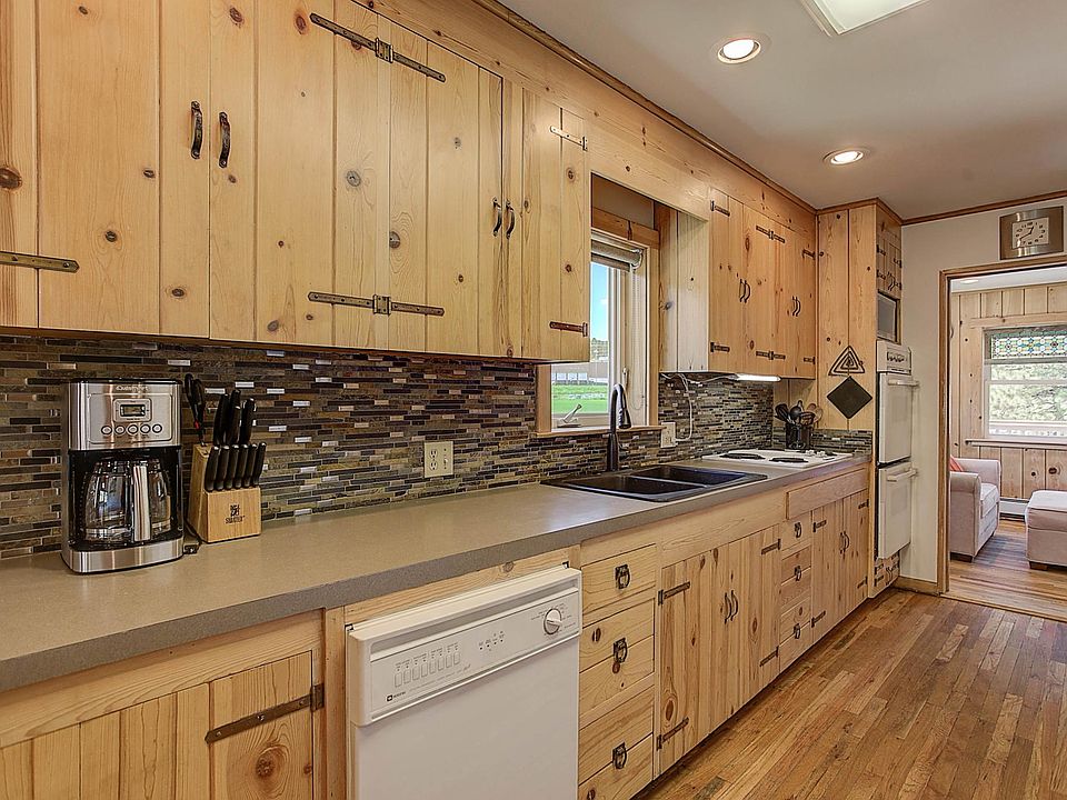 Kitchen looking into additional living area