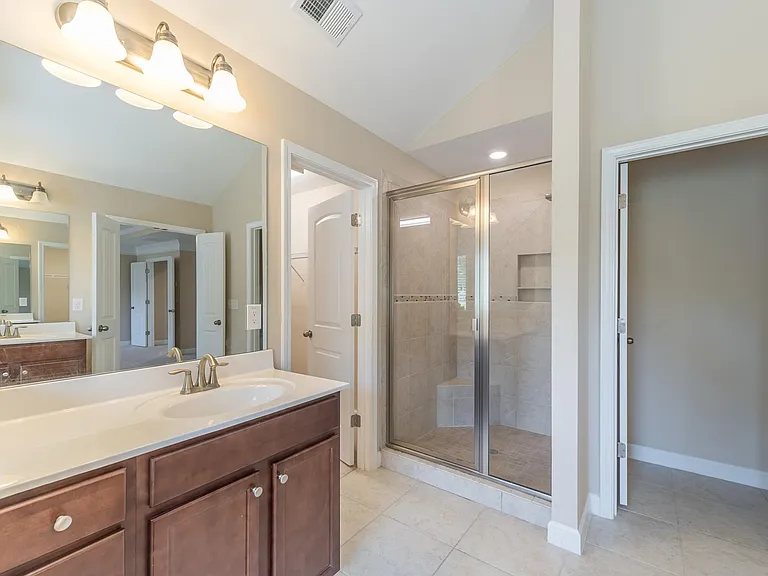 Master bath with stand-in shower and toilet in a separate room