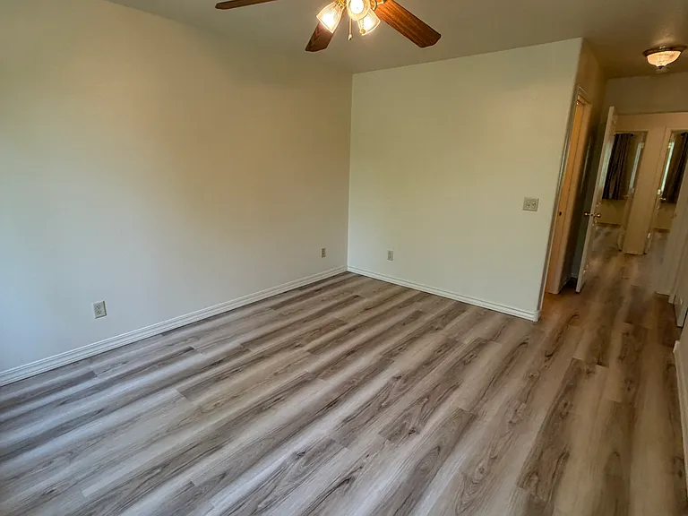Master bedroom, with ceiling fan.