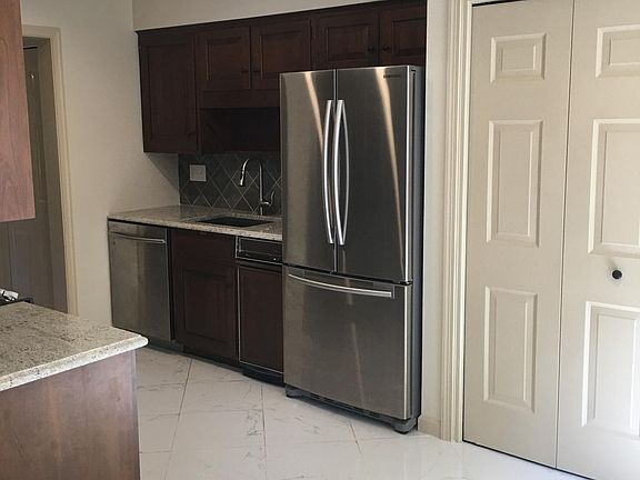 Kitchen features Marble Floors with Recess Lighting. Granite