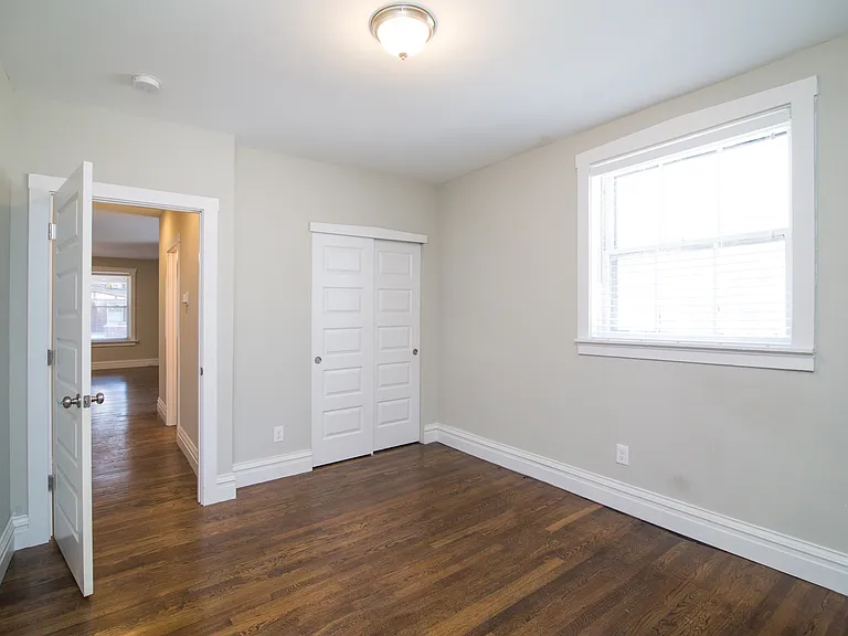 Smaller room with full size closet and fits Queen bed