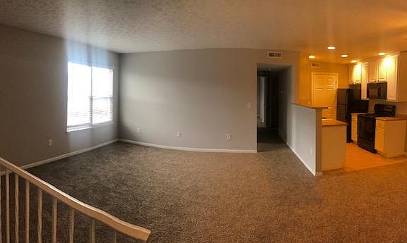 Panoramic of living area and kitchen/dining area