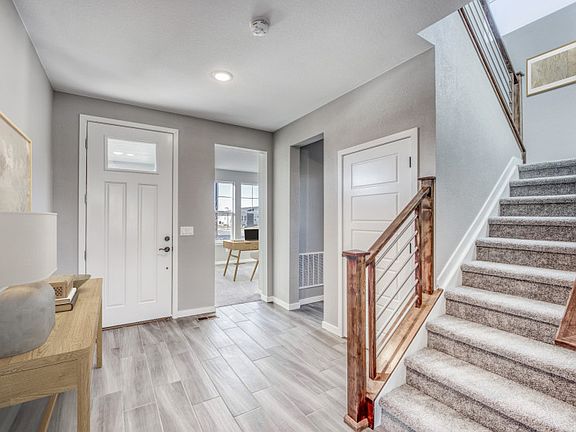 Enter the Brinnon to find a spacious entryway, powder bath, and private den.