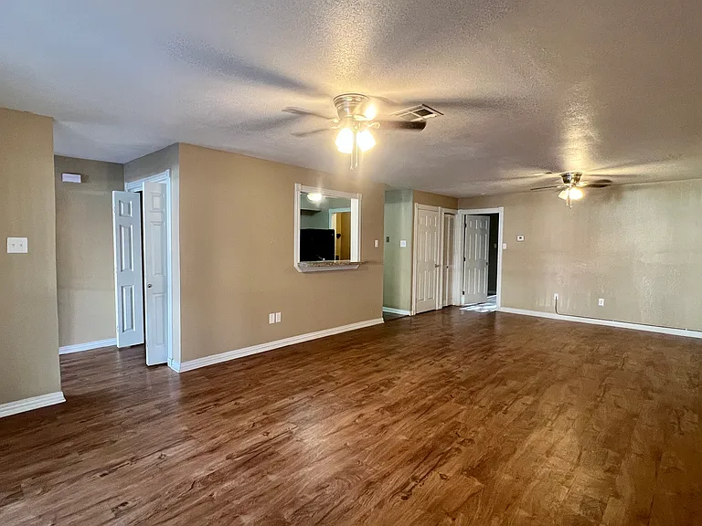 Entry foyer with coat closet, open consept to living are and the den,open window for bar chairs